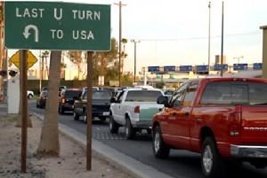 Road sign that says "Last U Turn to USA"