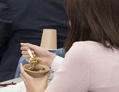 Woman eating rice sample at Medium Grain Foodservice Seminar in Japan