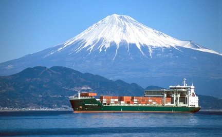 Container ship sailing in front of Mt Fuji Japan