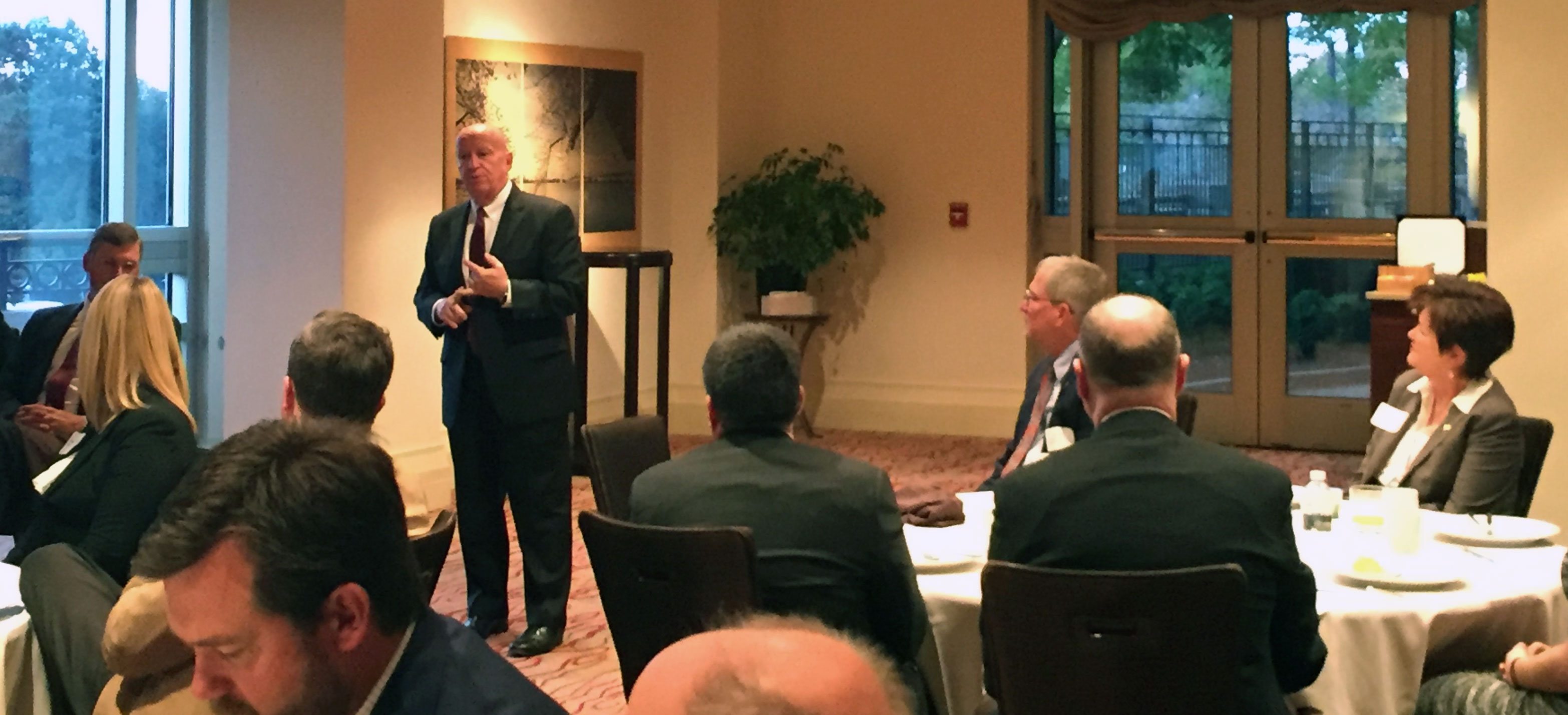 WMP-Oct-2017,-Rep-Kevin-Brady (standing) talks to USA Rice members (seated)