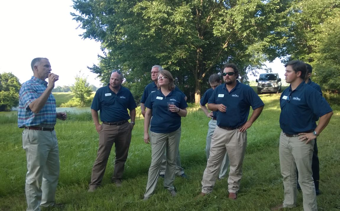 Leadership Class at George Dunklin duck camp, standing in rice field