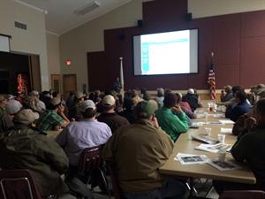 LA Acadia-Parish-rice-growers-gather-at-LSU, seated at tables looking at presentation on screen