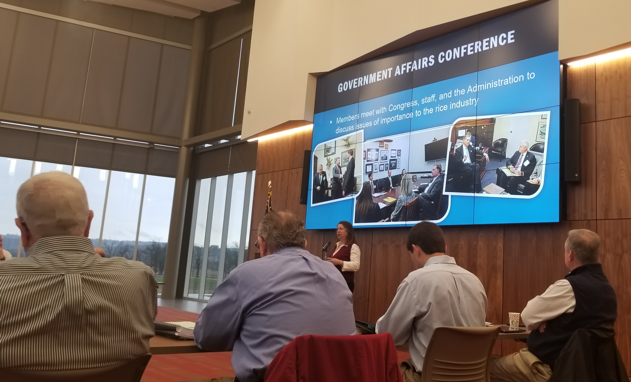 2018 ARRPB Mtg, Betsy Ward standing at podium giving a presentation under enormous screen