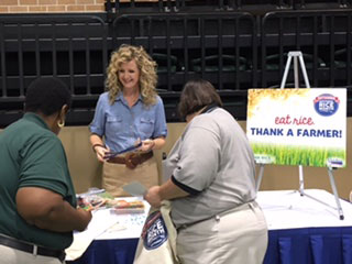 2016-Delta-Rice-Luncheon, Carrie Castille talks with visitors at booth