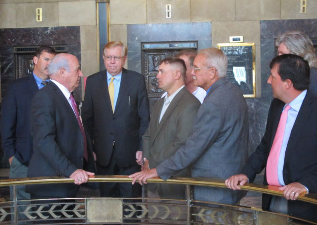 LA-Rice-Day,-Rep-Terry-Brown-& Farm Leaders stand in group near bank of elevators