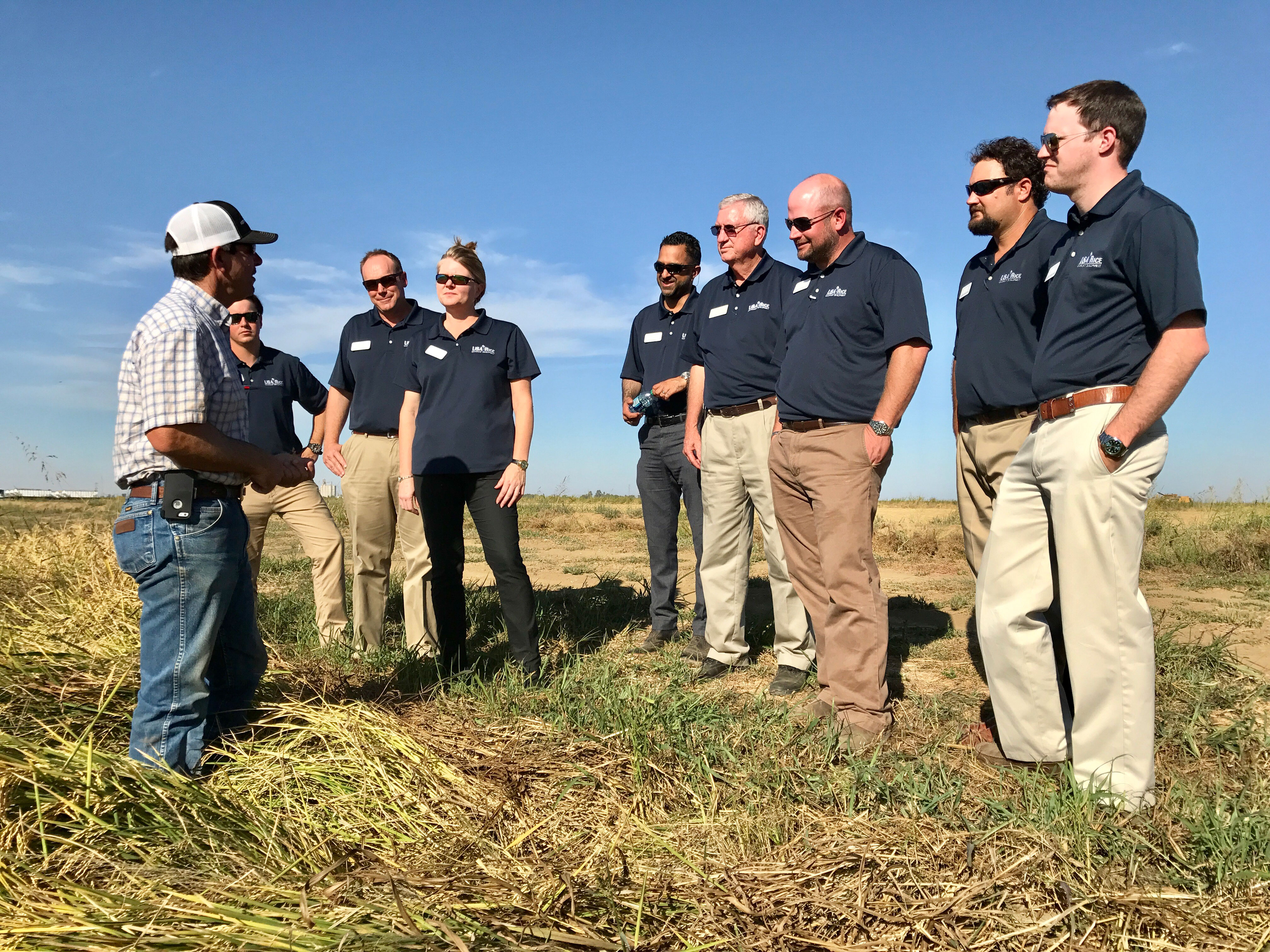 2017 Leadership-Class-&-Leo-LaGrande, standing in rice field