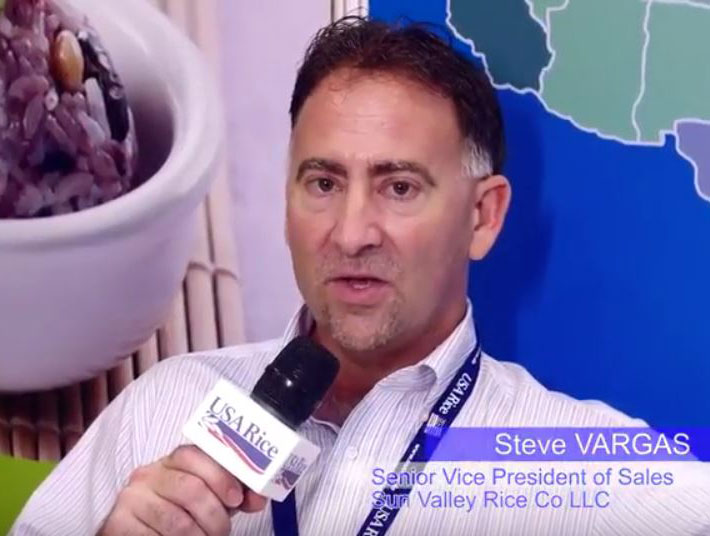 Steve-Vargas, headshot holding USA Rice microphone
