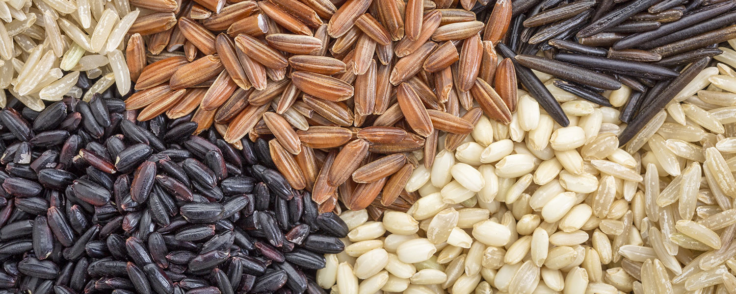 bg-whole-grain-rice Overhead view of different whole grain rice varieties.