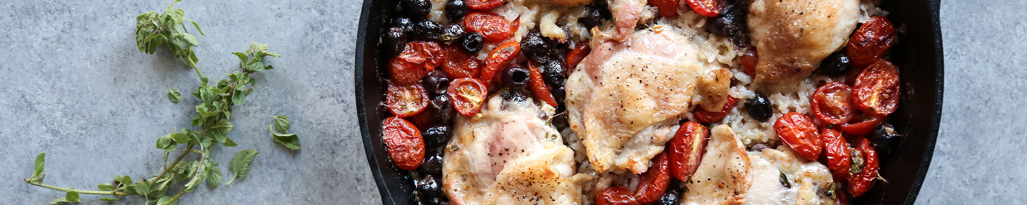 Chicken Rice Casserole Overhead image of chicken rice casserole with tomatoes.